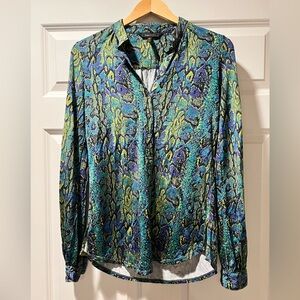 BCBGmaxazria blouse size XXS but very stretchy, will fit a Medium.